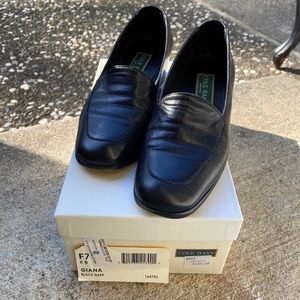 Black leather Cole Haan heeled loafers